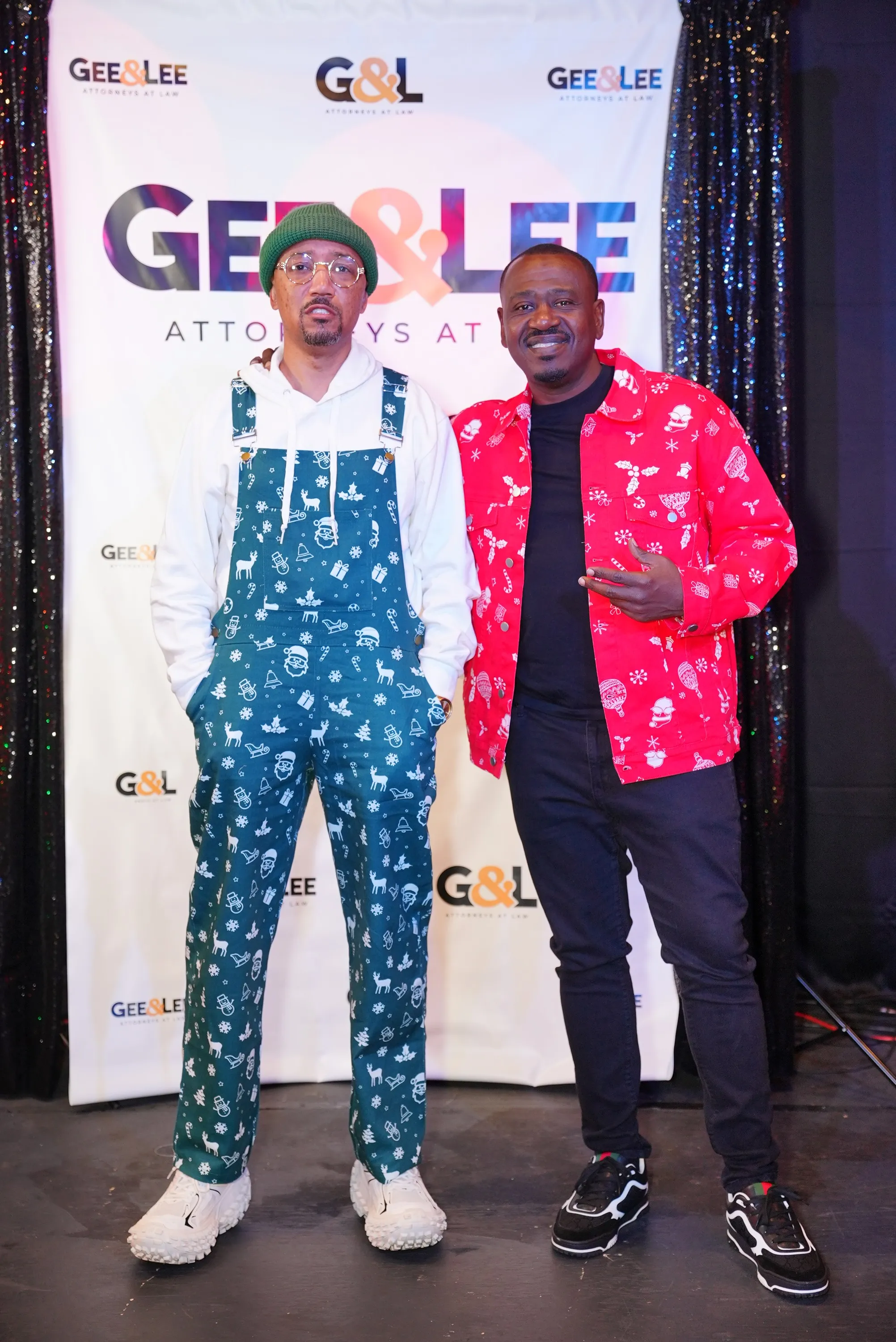 Attorneys Gee and Lee in festive outfits at their community Christmas event